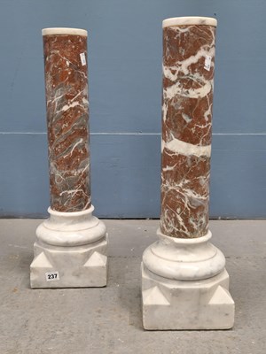 Lot 237 - A pair of white and variegated red marble columns