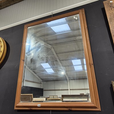 Lot 1549 - A large pine framed mirror.