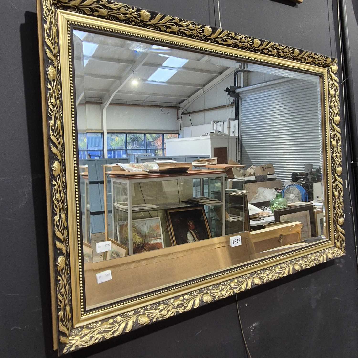 Lot 1552 - A gilt-framed mirror.