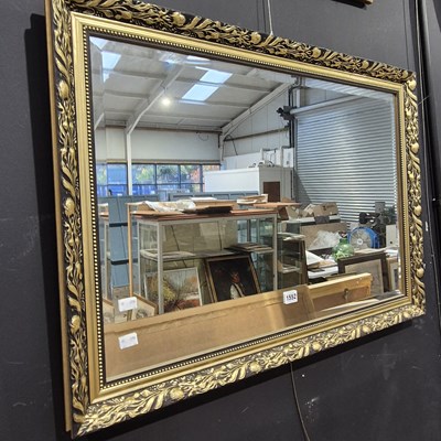 Lot 1552 - A gilt-framed mirror.