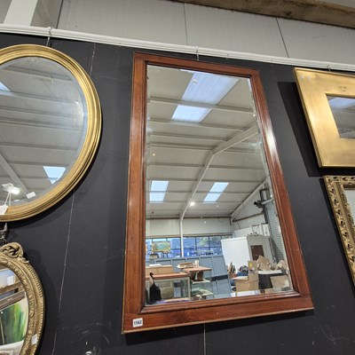 Lot 1562 - A large mahogany framed mirror.