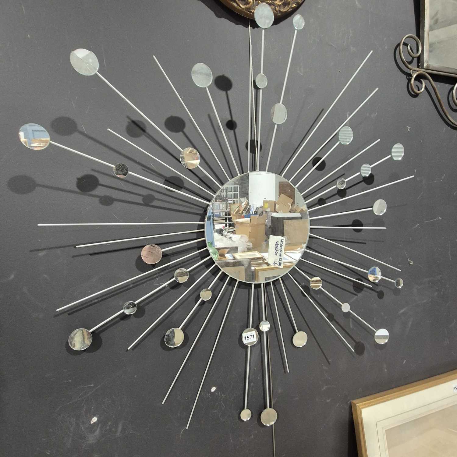 Lot 1571 - A modernist "starburst" mirror.