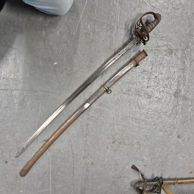 Lot 151b - An antique infantry sword in a steel scabbard.