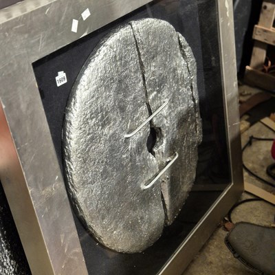 Lot 1609 - A framed, silvered rustic disc or wheel