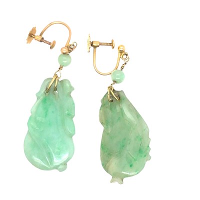 Lot 1004 - A pair of carved green jade drop earrings with...