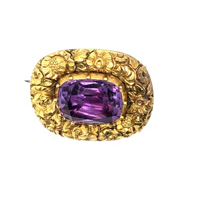 Lot 1005 - A Victorian 15ct gold gemset brooch. The...