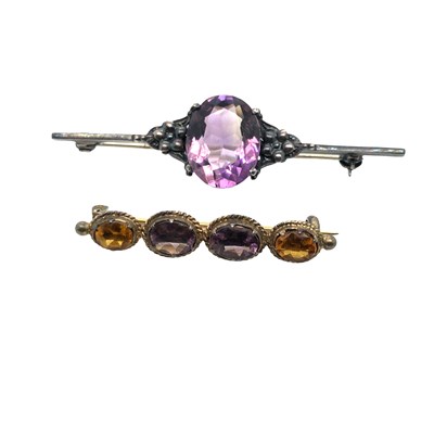 Lot 1019 - An antique silver bar brooch set with a large...