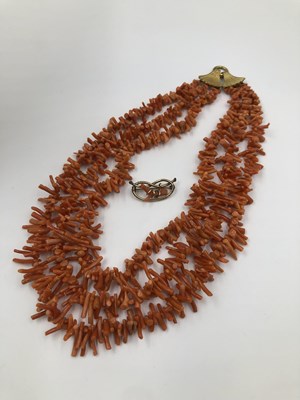 Lot 1024 - A four-strand branch coral necklace fitted...