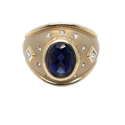 Lot 1037 - A 9ct hallmarked gold gem-set dress ring in a...