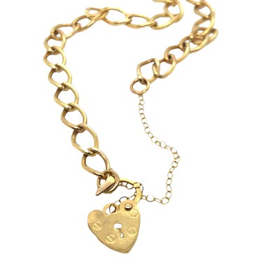Lot 1048 - A 9ct hallmarked gold curb link charm bracelet,...