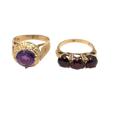 Lot 1049 - A vintage oval faceted amethyst ring in a...