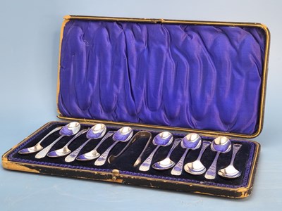 Lot 1172 - A cased set of twelve silver tea spoons with...