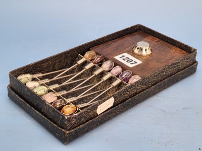 Lot 1207 - A boxed set of twelve cocktail sticks with...