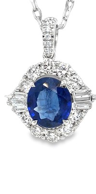 Lot 1050 - An 18ct white gold oval sapphire and diamond...