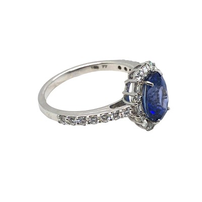 Lot 1038 - A certificated 18ct white gold oval sapphire...