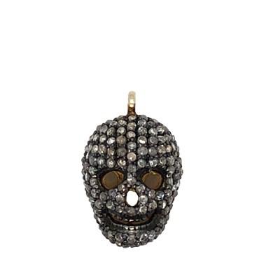 Lot 1068 - A diamond-encrusted skull pendant, set in...