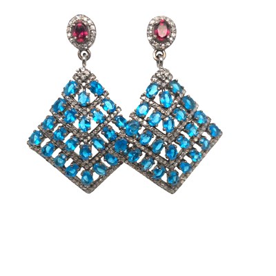 Lot 1034 - A pair of silver flared drop earrings set with...