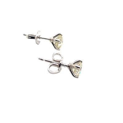 Lot 1062 - A pair of 18ct white gold round brilliant cut...