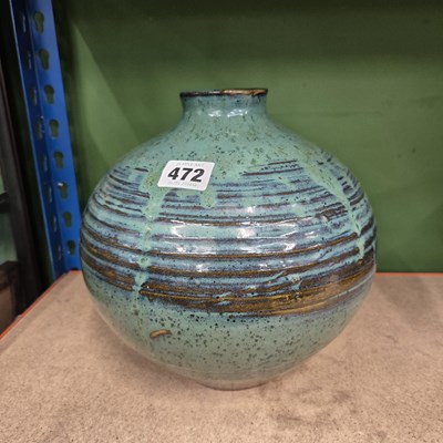 Lot 472 - A green glazed spherical studio pottery vase,...