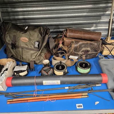 Lot 488 - Fishing reels, a fishing bag, three leather...