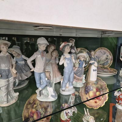 Lot 504 - Nine Lladro and Nao figurines together with...