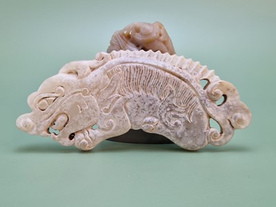 Lot 1212 - A Chinese grey agate mountain inscribed below...