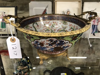 Lot 1217 - A Chinese clobbered blue and white bowl...