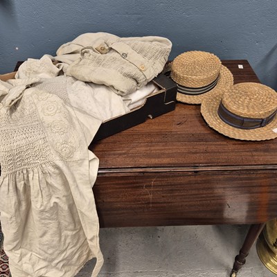 Lot 1234 - A child's smock, two adult's smocks, two table...