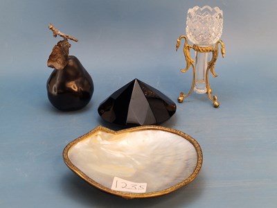 Lot 1235 - A gilt metal mounted nacreous shell, a pear...