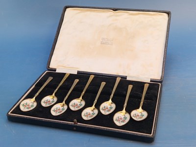 Lot 1236 - A cased set of silver gilt tea spoons with...