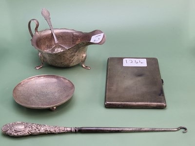 Lot 1244 - A silver tripod sauce boat by Viners,...