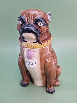 Lot 1249 - A late 19th century majolica pug dog form...