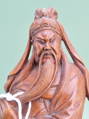 Lot 1250 - A Chinese carved wooden figure of Guandi.   H...