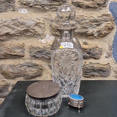 Lot 1254 - A silver mounted cut glass spirit decanter,...