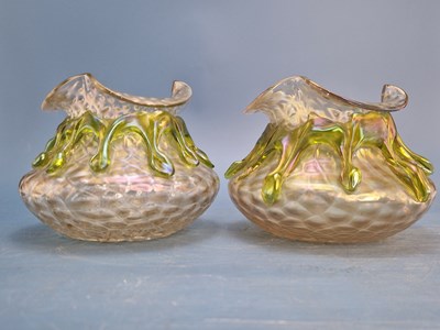 Lot 1260 - A pair of Loetz style iridescent glass bowl...