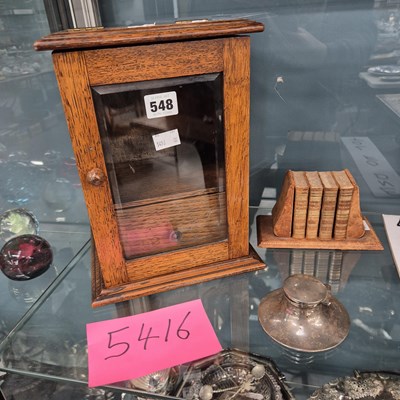 Lot 548 - A silver capstan inkwell, a leather press of...