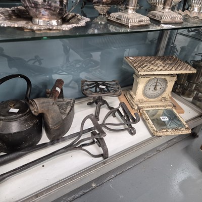 Lot 551 - Two branding irons, an iron kettle, a trivet,...