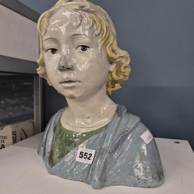 Lot 552 - A Della Robbia style faenza bust of a blond child