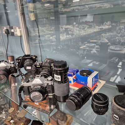 Lot 559 - Two Pentax and two Canon cameras together some...