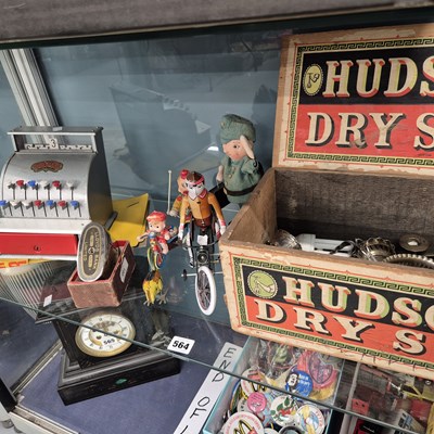 Lot 564 - A toy cash till, clockwork tin plate toys,...