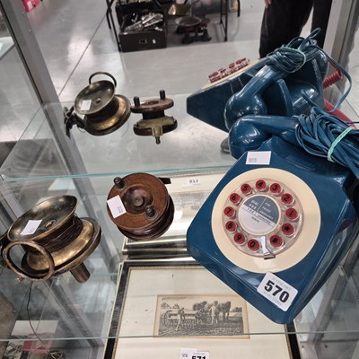 Lot 570 - A blue telephone set together with two fishing...