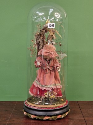 Lot 1269 - A musical automaton under a glass dome with a...