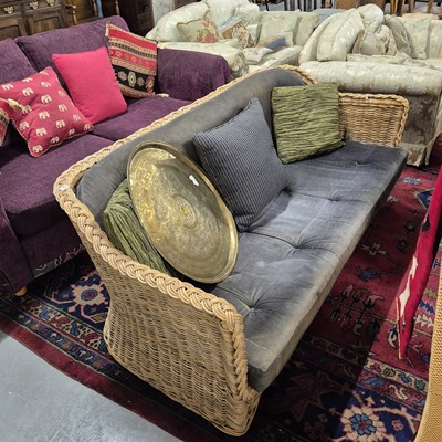 Lot 18 - A good quality rattan sofa.
