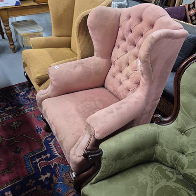 Lot 20 - A large antique wing back armchair.
