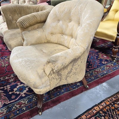Lot 24 - A Victorian button back armchair with shaped...