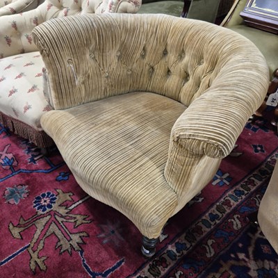 Lot 25 - An antique button back tub chair.