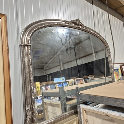 Lot 1915 - A large overmantle mirror with silvered frame.