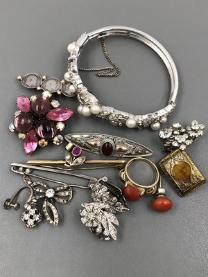 Lot 1110 - An antique diamond and gemset bar brooch,...