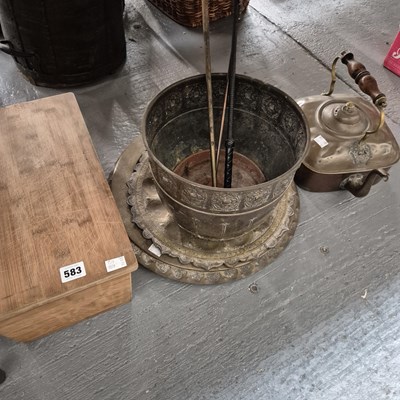 Lot 583 - Eastern brass dishes, a copper kettle, a...