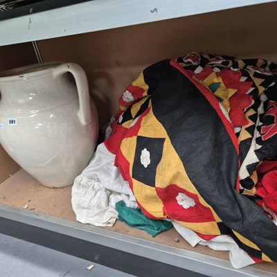 Lot 591 - A textile banner together with a white glazed...